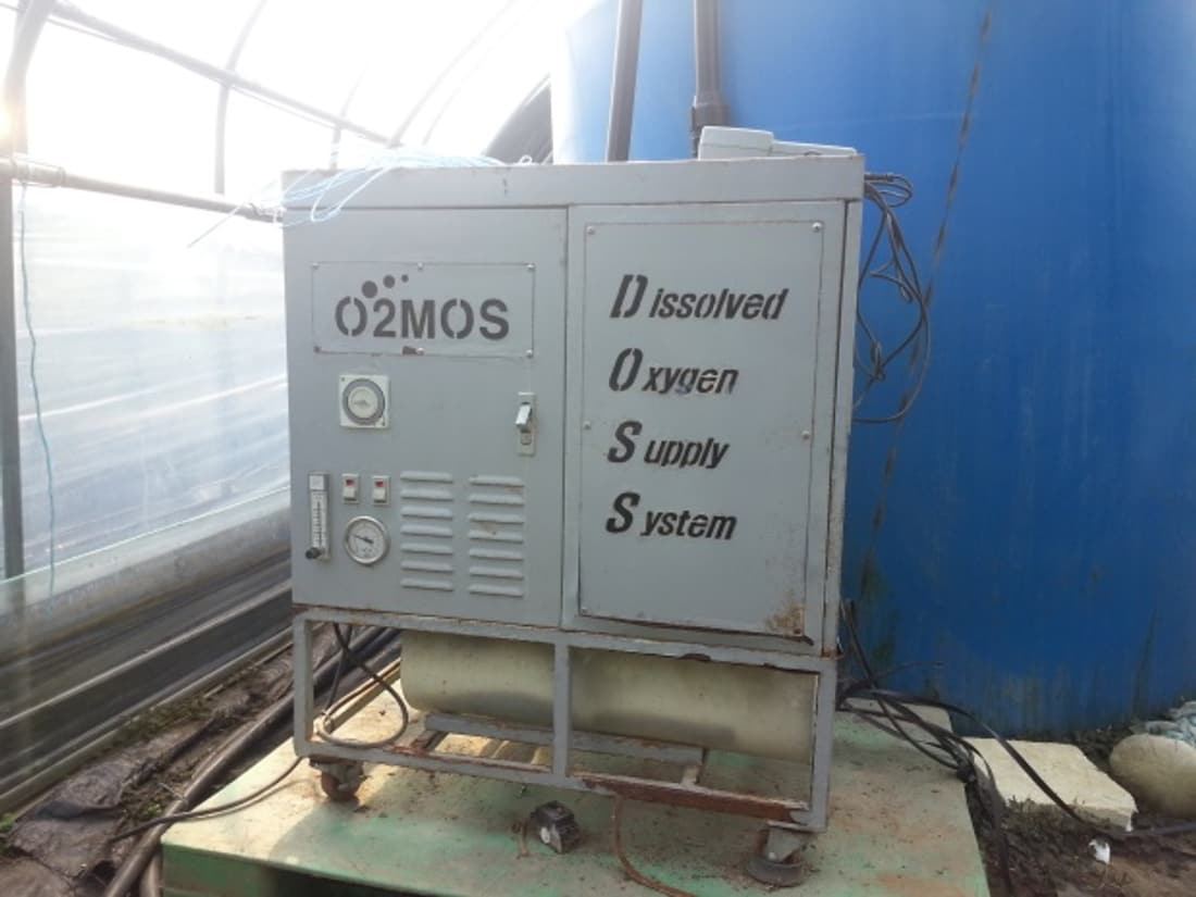 O2MOS Dissolved Oxygen Supply System unit in a farm setting