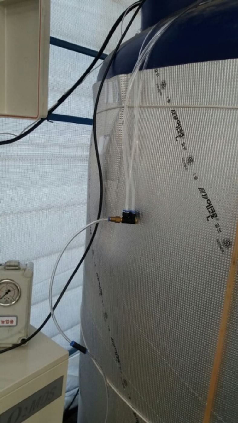 Oxygen line feeding a strawberry nutrient solution tank